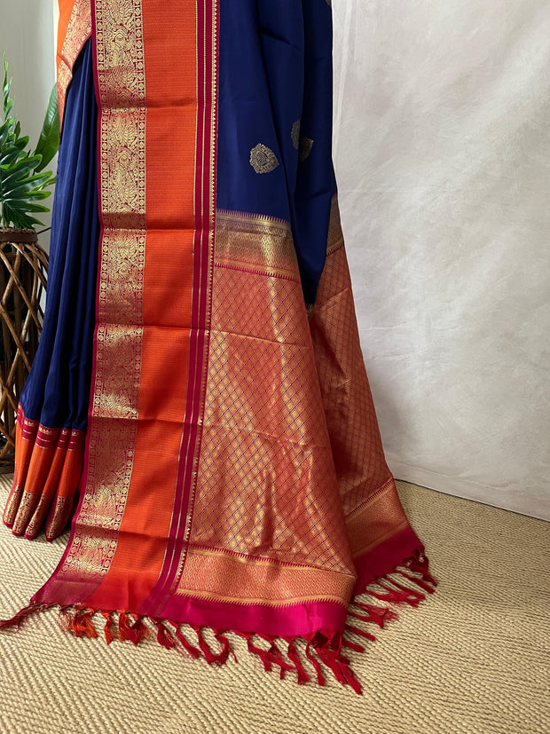 Blue Kanchivaram saree with pink and orange border, and stitched blouse