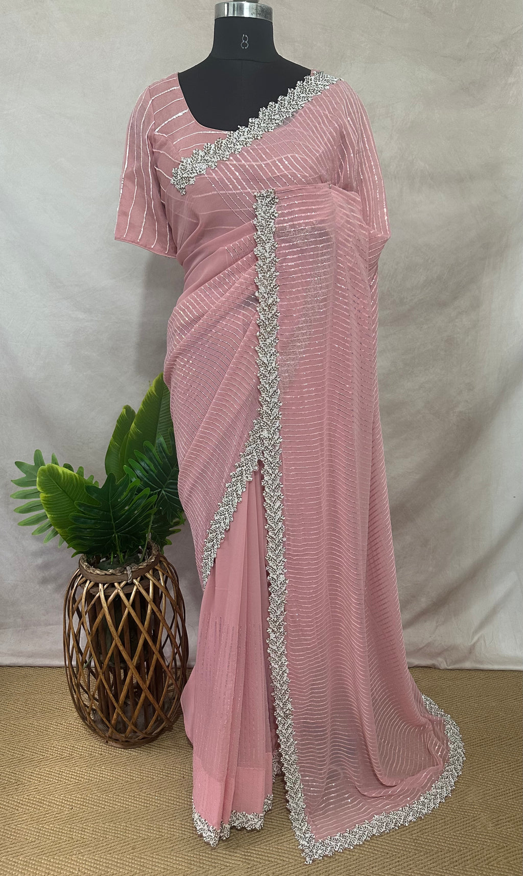 Light pink georgette saree with bead embroidery and stitched blouse