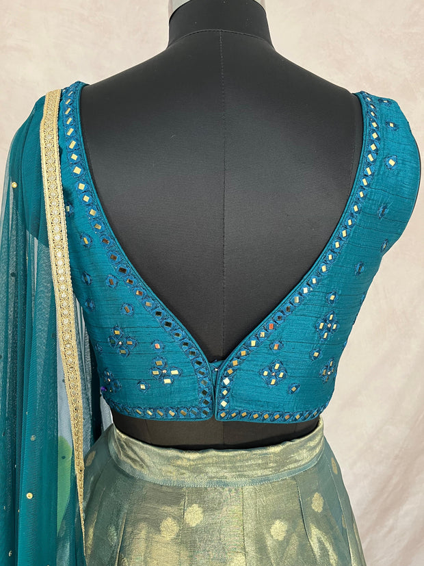 Peacock blue tissue silk lehanga with mirror work blouse