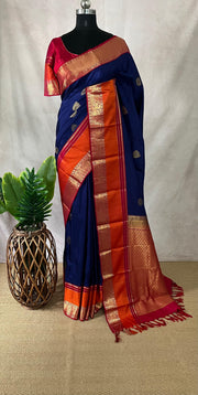 Blue Kanchivaram saree with pink and orange border, and stitched blouse