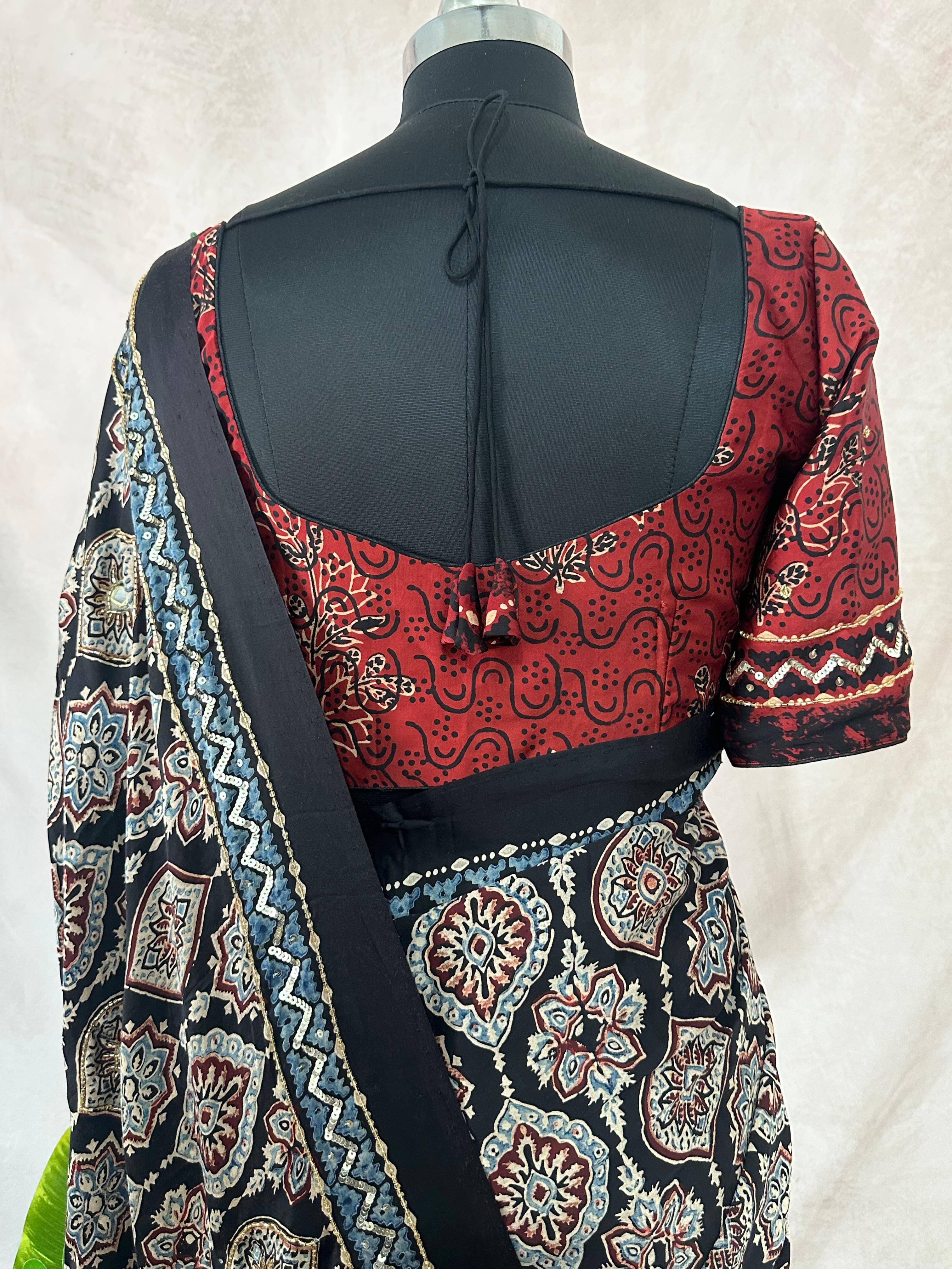 Designer Ajrakh modal silk saree with bead and mirroer handwork, stitched blouse
