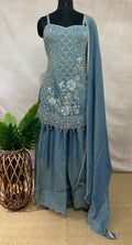 Light blue deisgner short top with flared bottom