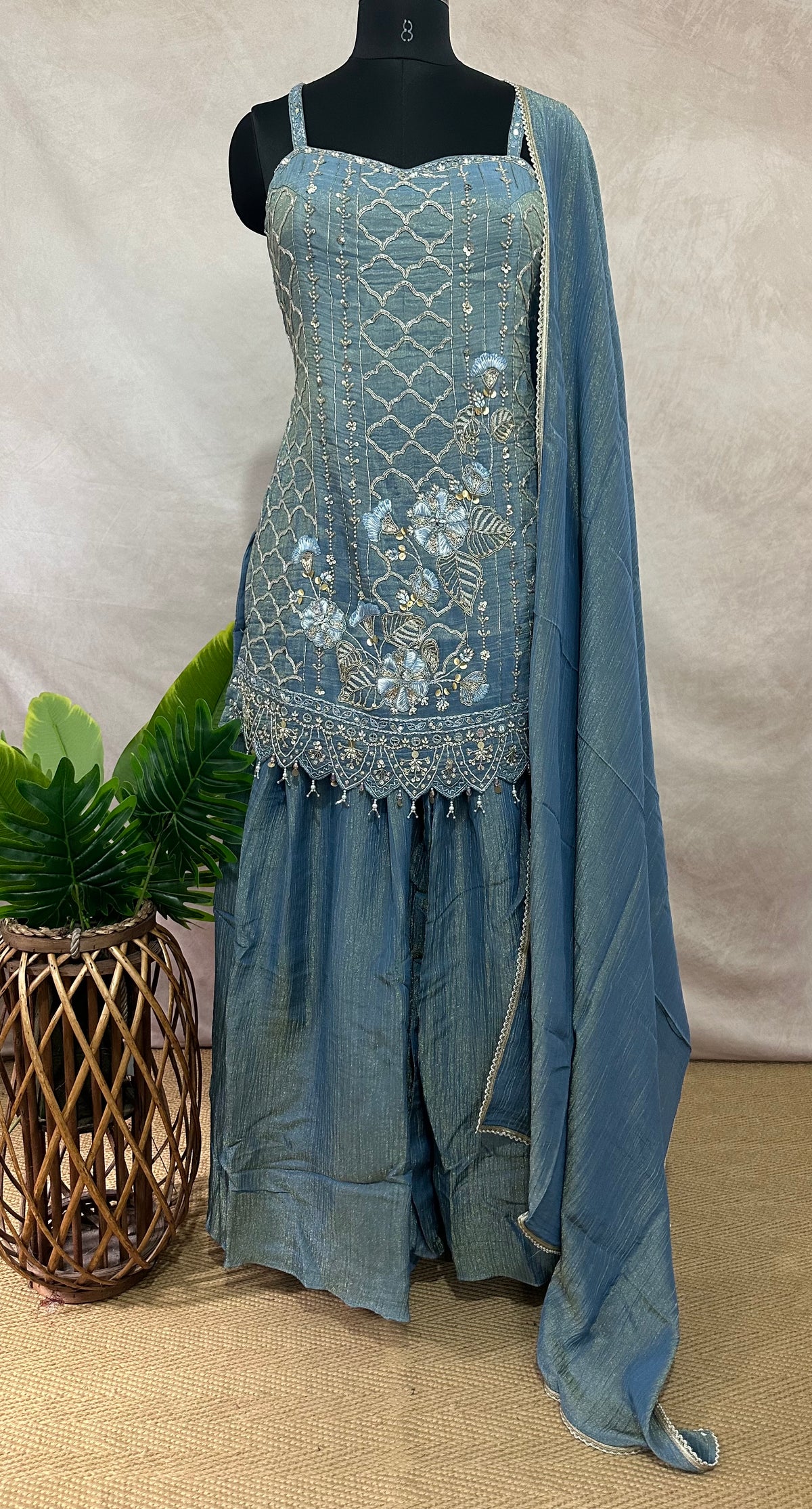 Light blue deisgner short top with flared bottom