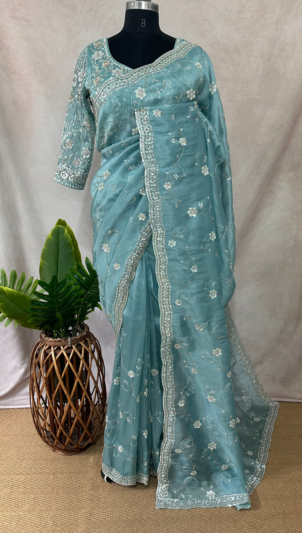 Blue tissue designer saree with stitched blouse and under skirt