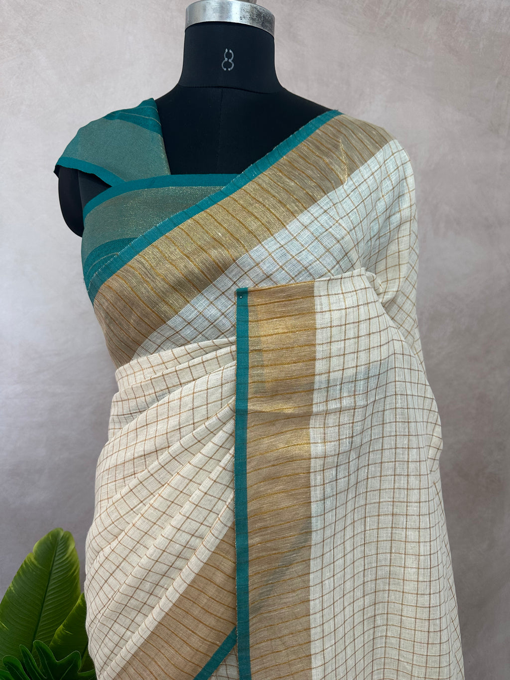Linen saree with small chck and green border