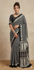 Designer Ajrakh modal silk saree with bead and mirroer handwork, stitched blouse