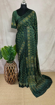 Green modal silk saree with hand work and stitched blouse
