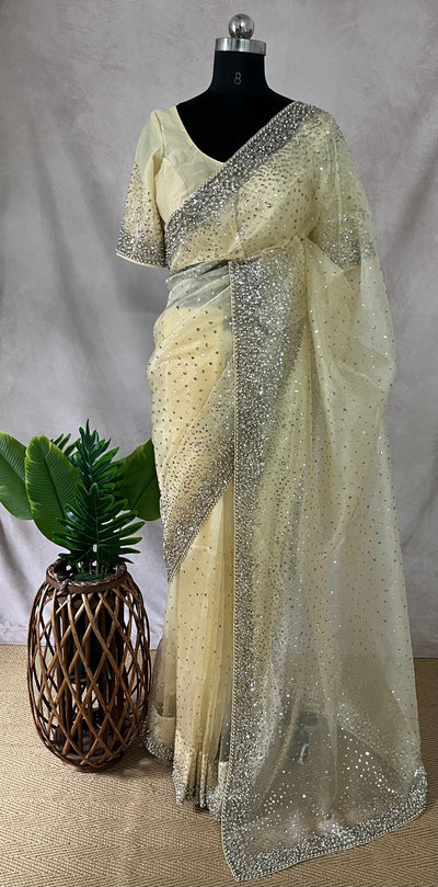 Soft Organza Light Yellow color saree with sequins work and stitched blouse