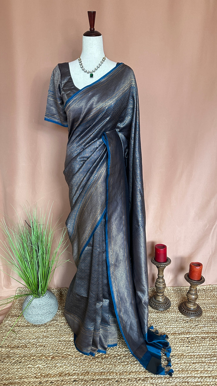 Blue brocade organza saree with stitched blouse