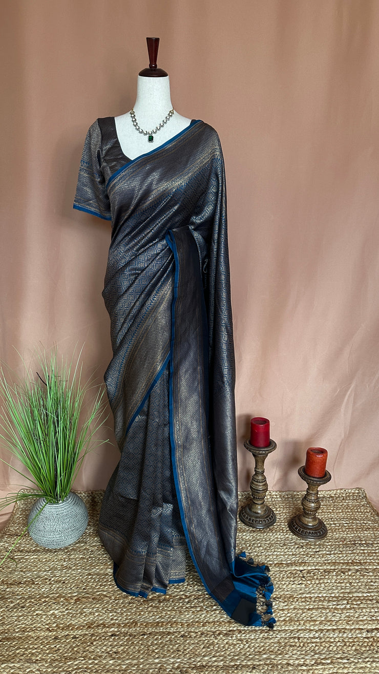 Blue brocade organza saree with stitched blouse