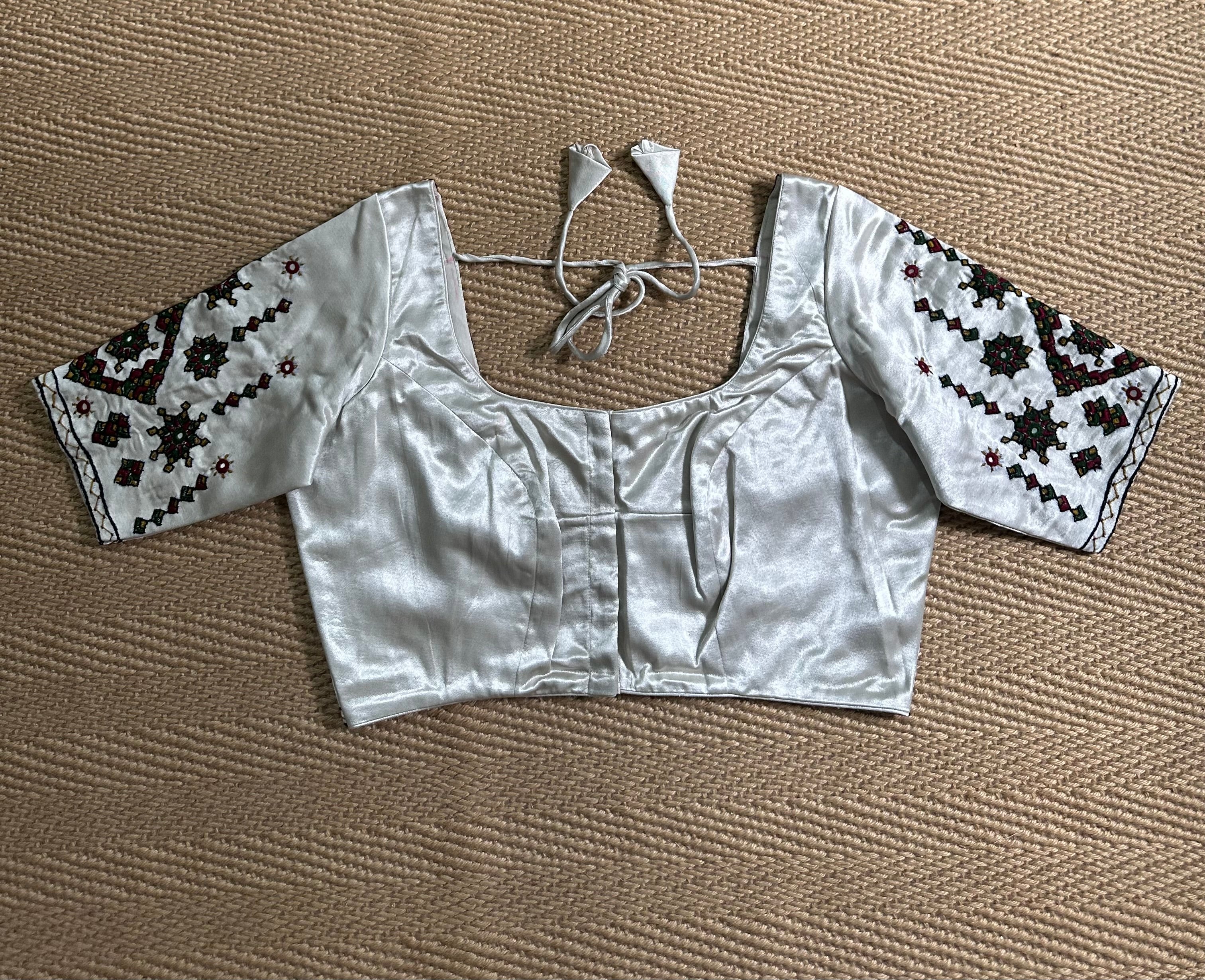 Light grey modal silk blouse with mirror work and hand Kutch Embroidery