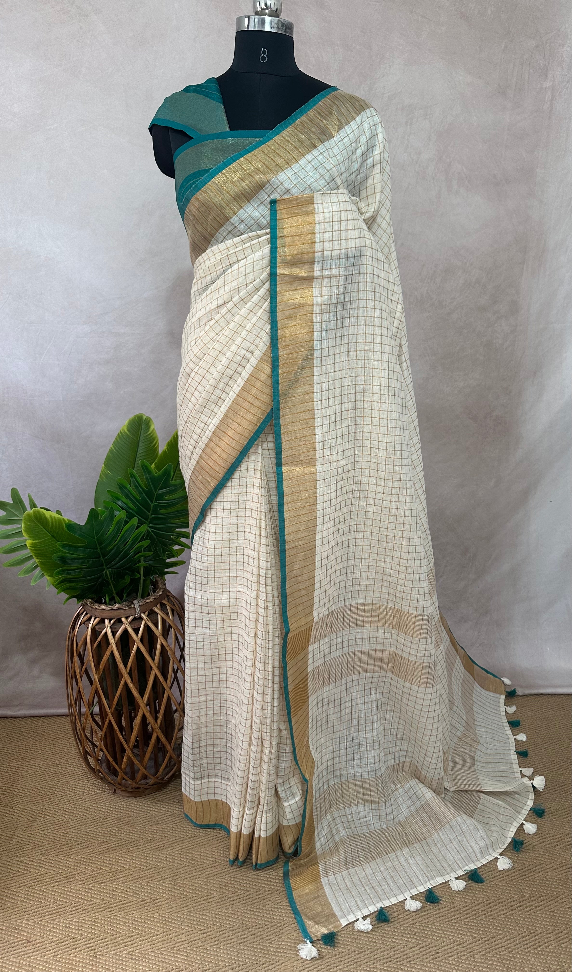 Linen saree with small chck and green border