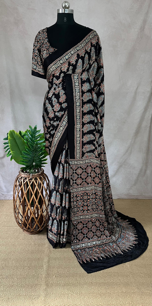 Black modal silk saree with hand work and stitched blouse