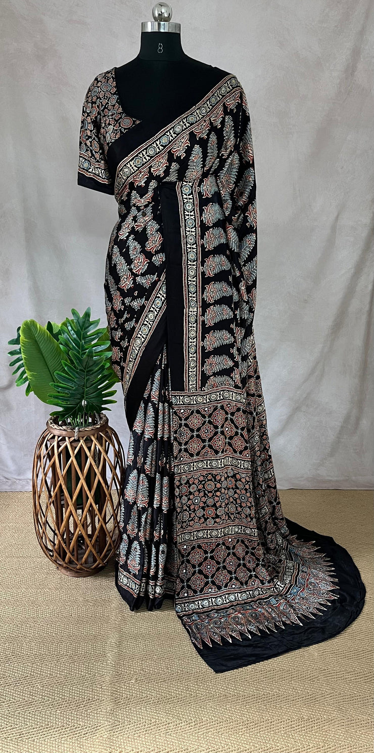 Black modal silk saree with hand work and stitched blouse
