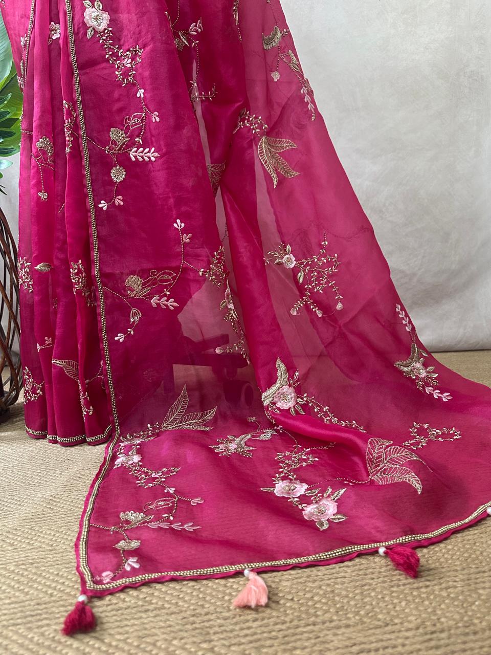 Pink organza saree with han embroidery and stitched blouse