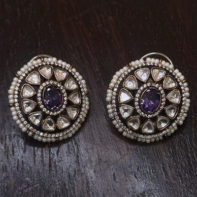 Moissanite stud with purple stone