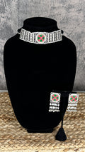 Choker with green and pink stones and studs