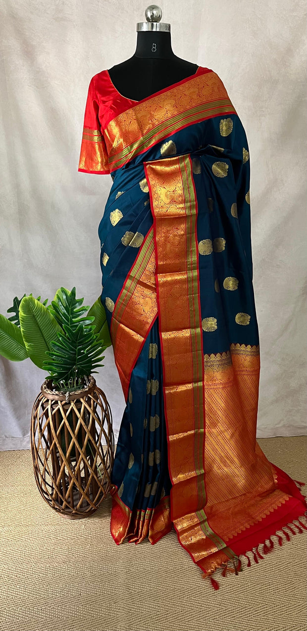 Peacock blue and red Kanchivaram saree with stitched blouse
