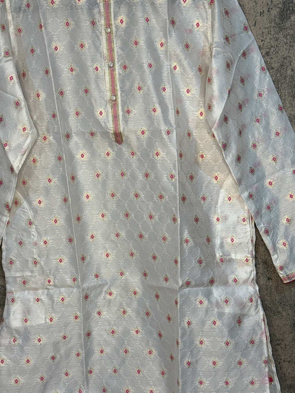 White cotton silk kurti with gold and pink self embosed emroidery
