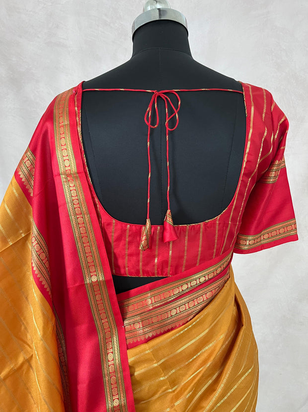 Mustard yellow and red Kanchivaram saree with stitched blouse