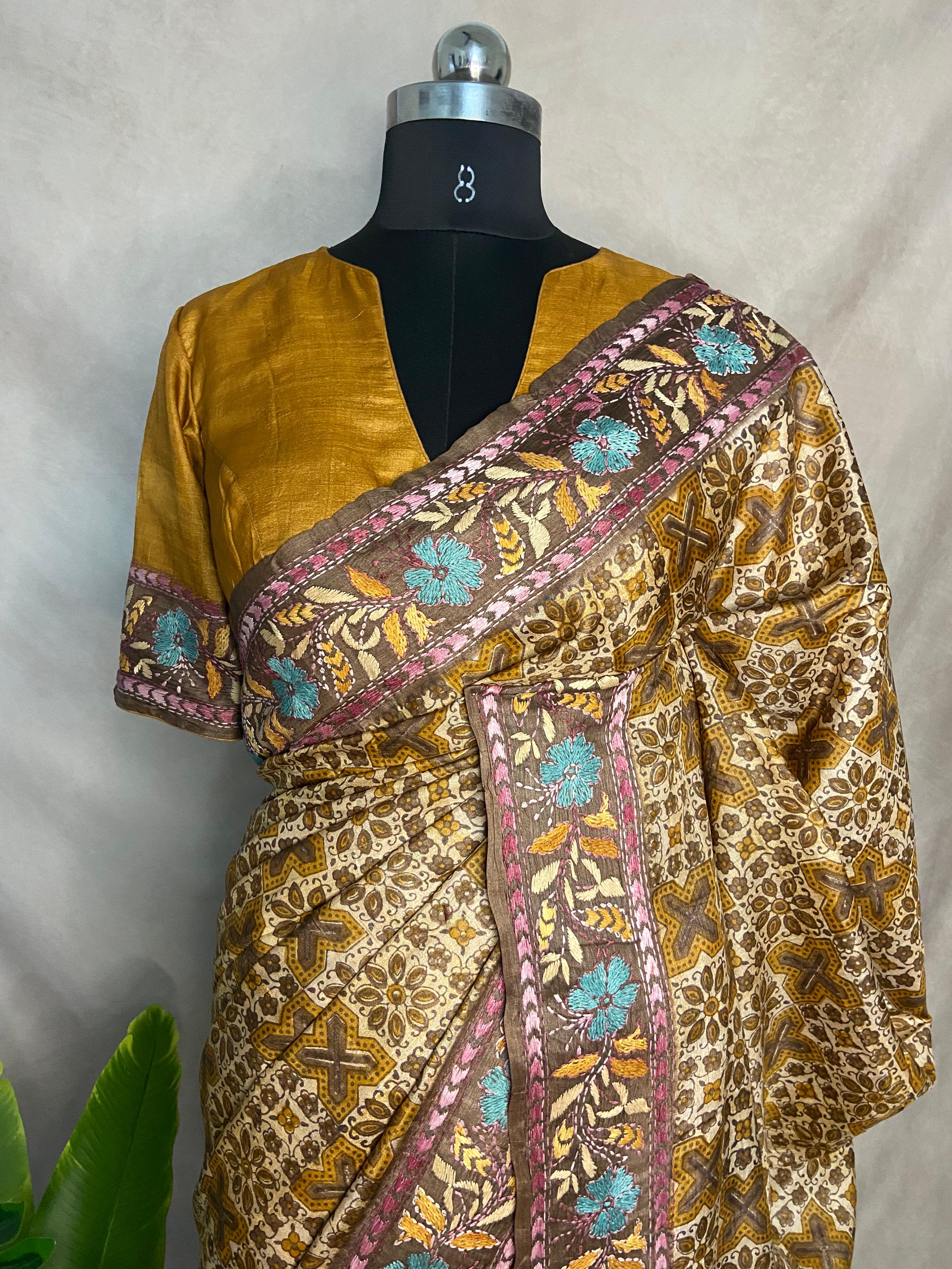 Pure tussar silk saree with Ajrakh hand block print and hand embroidery, stitched blouse