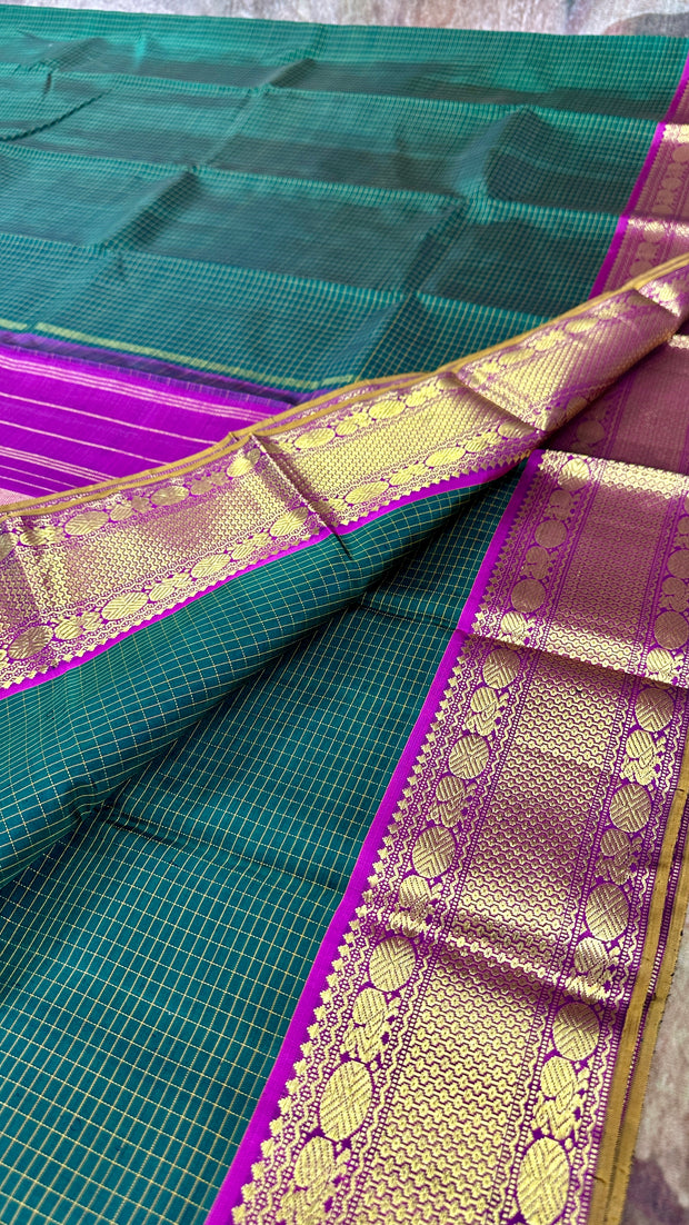 Bottle green kanchipuram silk hand woven saree with wine red border , stitched blouse