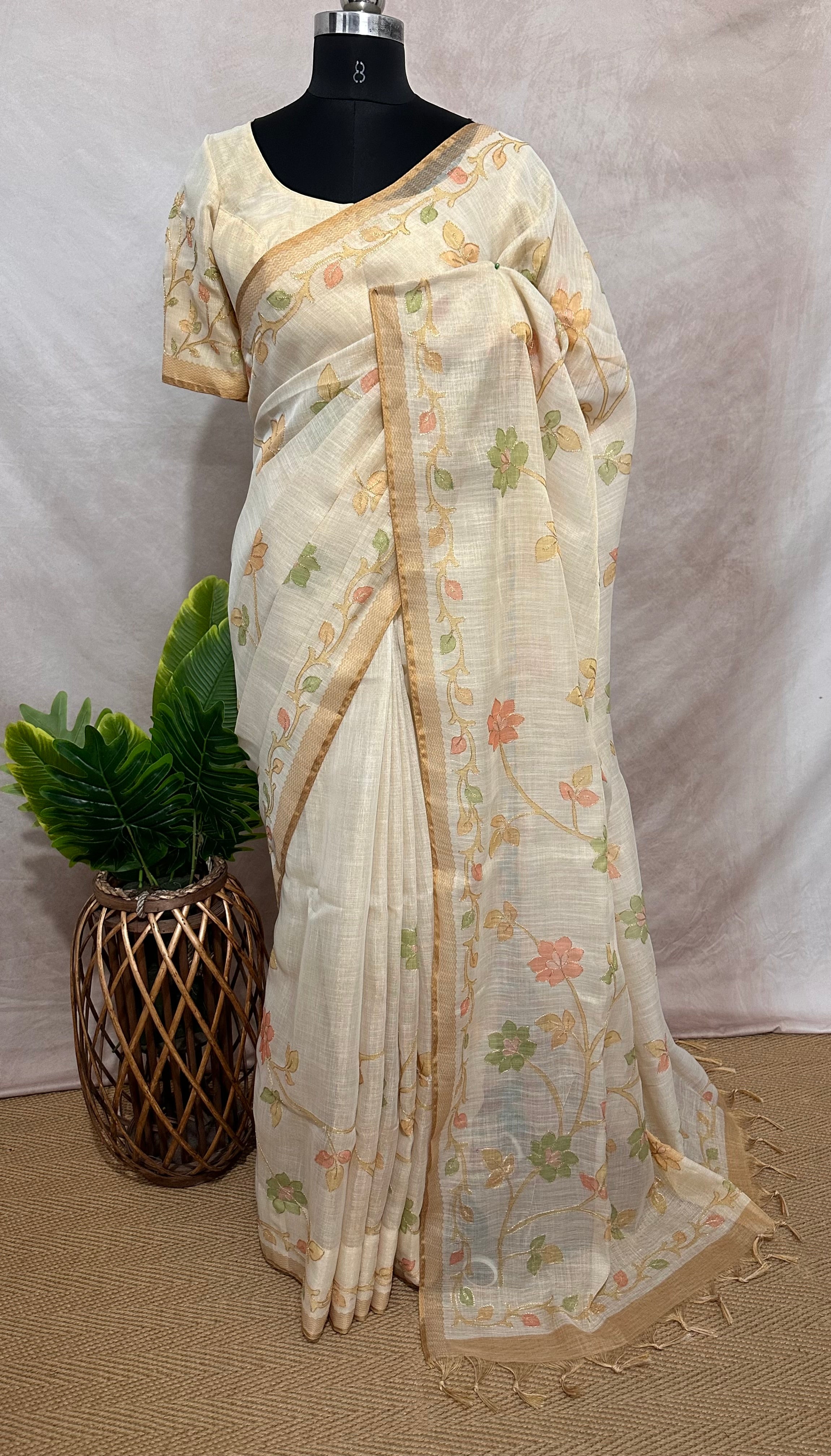 Printed Tissue linen saree with thread work, and stitched blouse