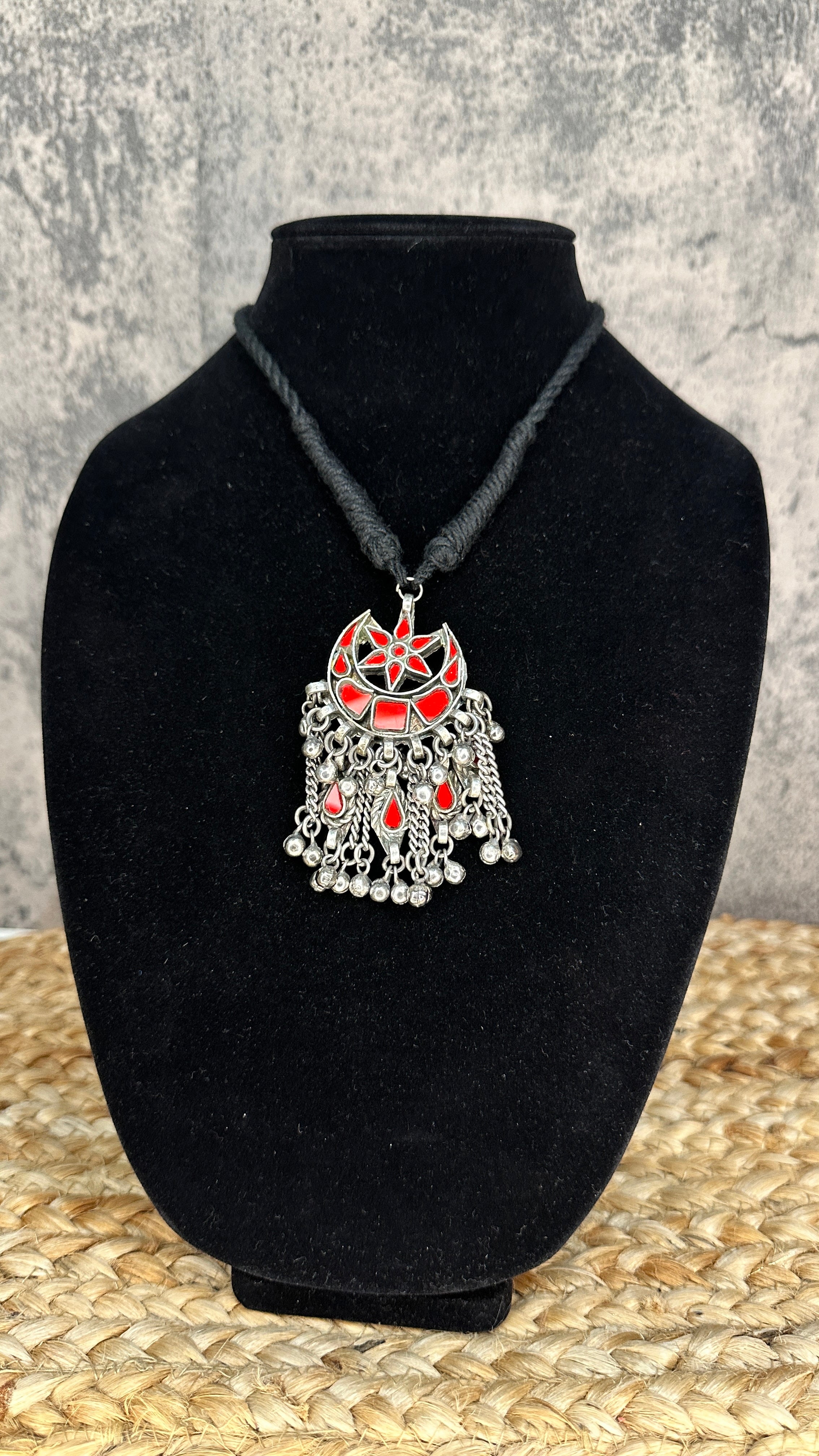 Indian red glass pendent with black thread