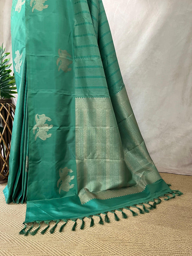 Light peacock Green Kanchivaram saree with stitched blouse
