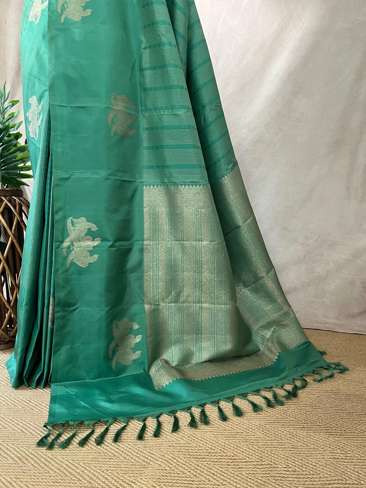 Light peacock Green Kanchivaram saree with stitched blouse