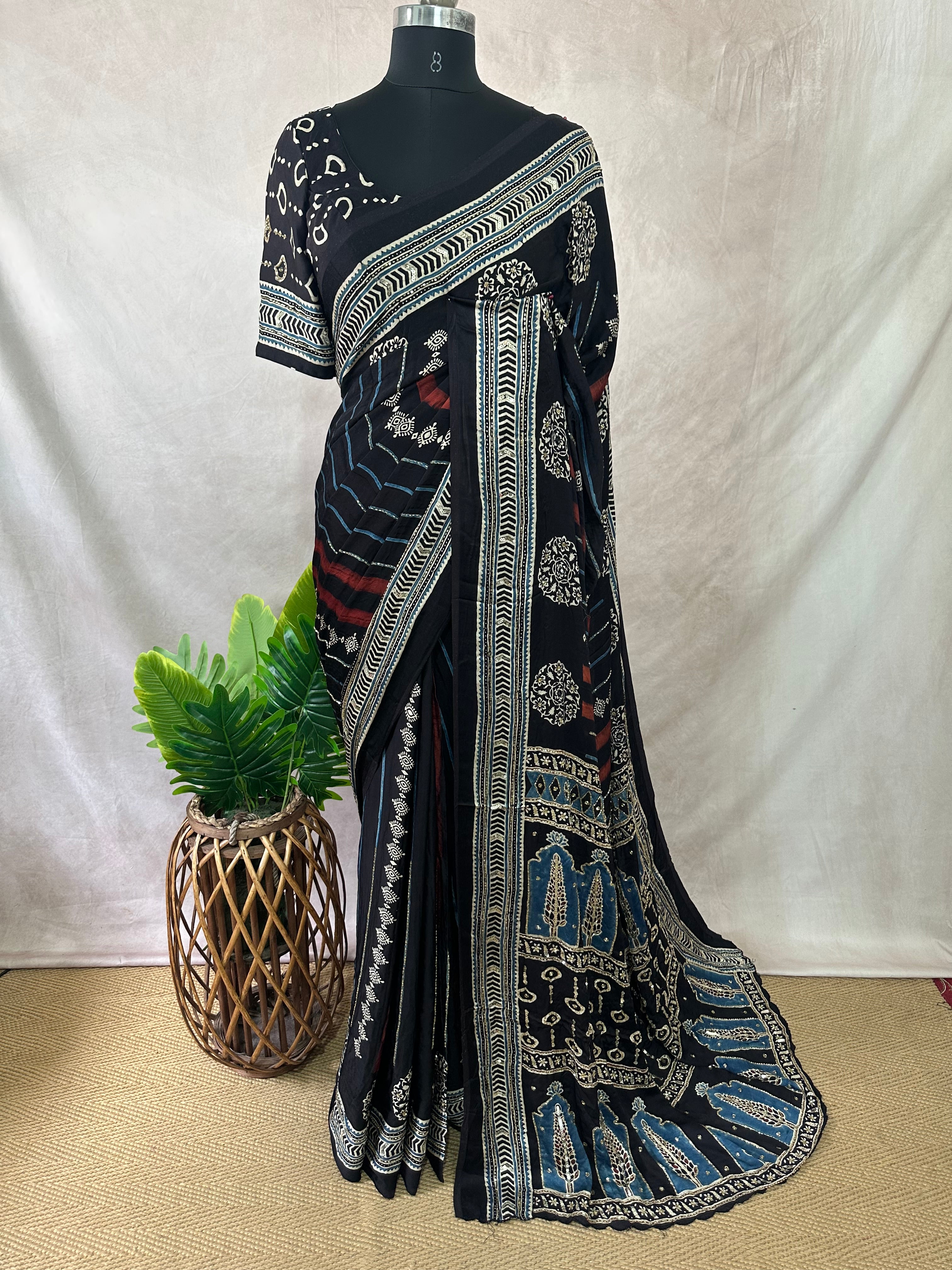 Modal silk saree with bead and mirror work , stitched blouse