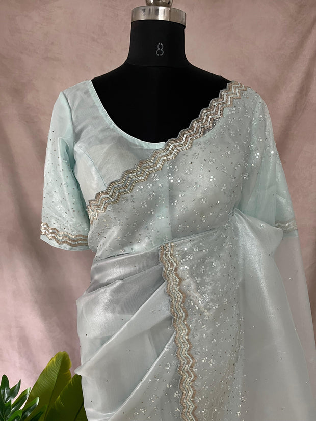 Light blue soft tissue organza designer saree with stitched blouse