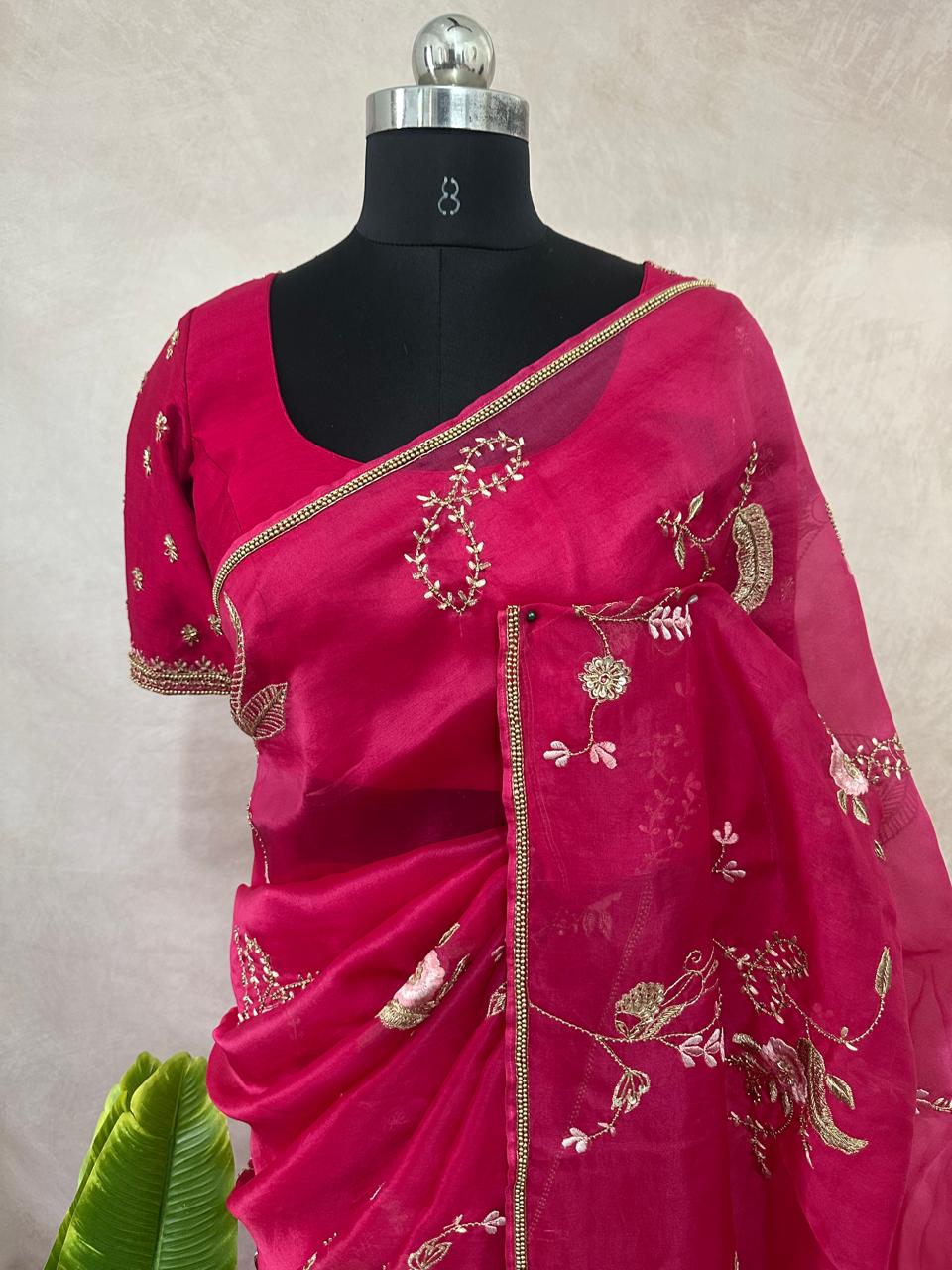 Pink organza saree with han embroidery and stitched blouse