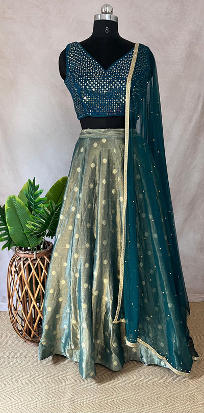 Peacock blue tissue silk lehanga with mirror work blouse