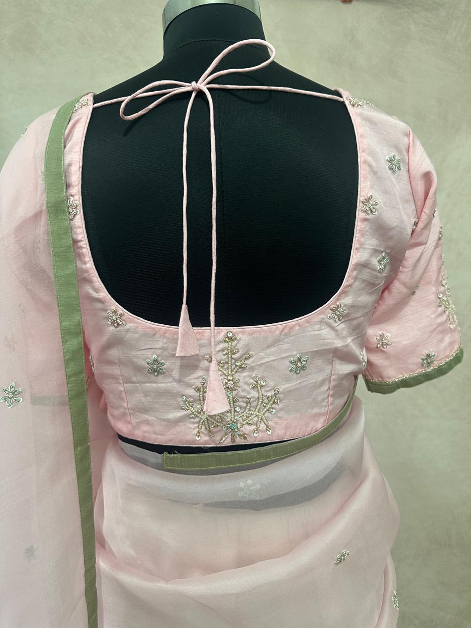 Pastel pink and green designer organza saree with stitched blouse