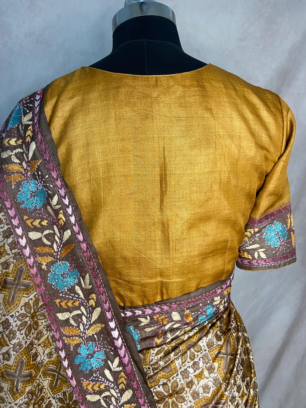 Pure tussar silk saree with Ajrakh hand block print and hand embroidery, stitched blouse