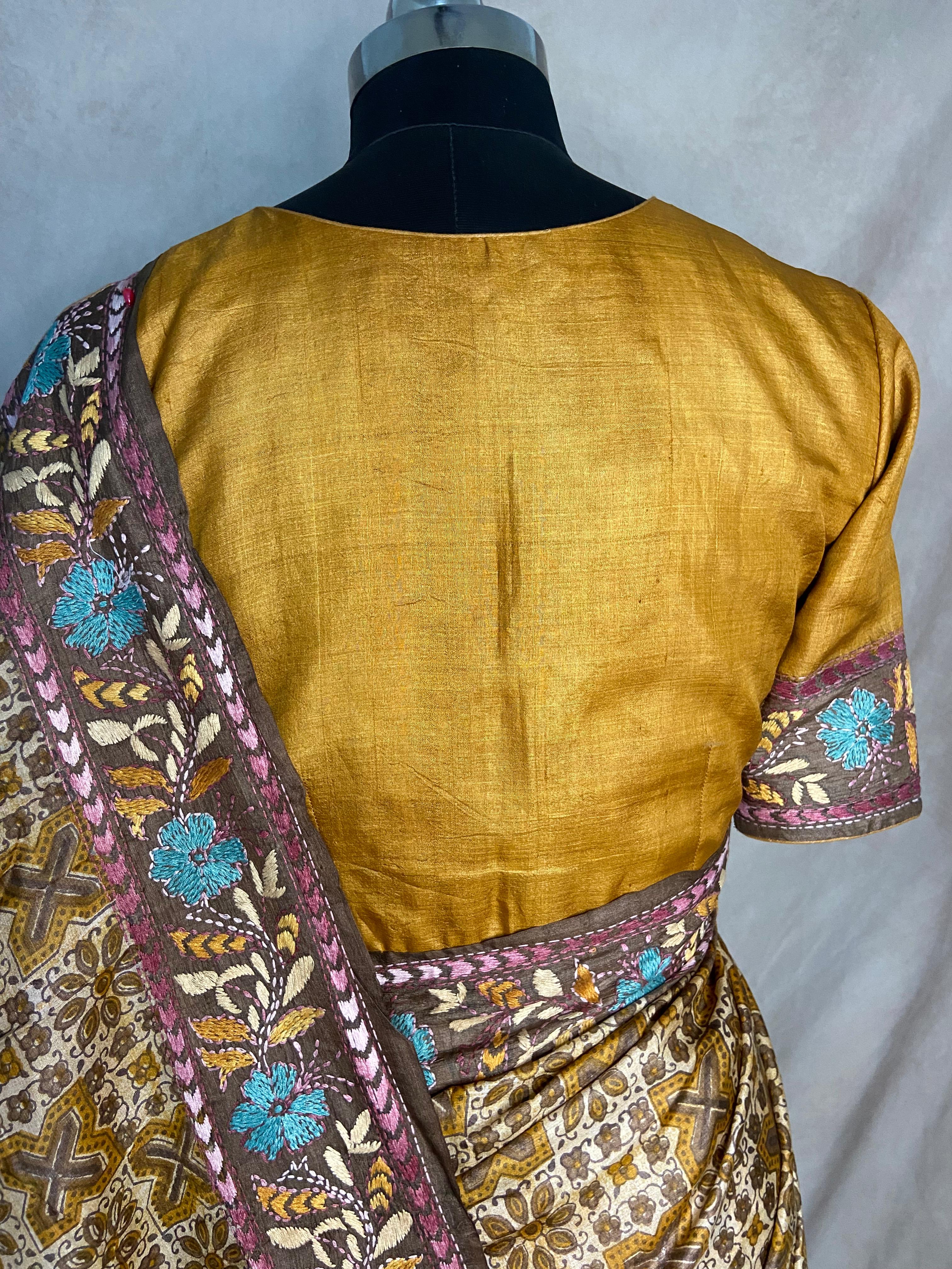 Pure tussar silk saree with Ajrakh hand block print and hand embroidery, stitched blouse