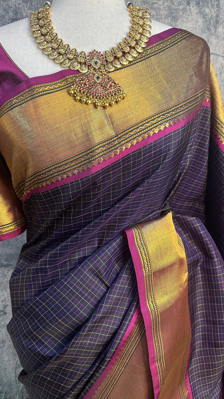 Navy blue Kanchivaram saree with purple border, with stitched blouse