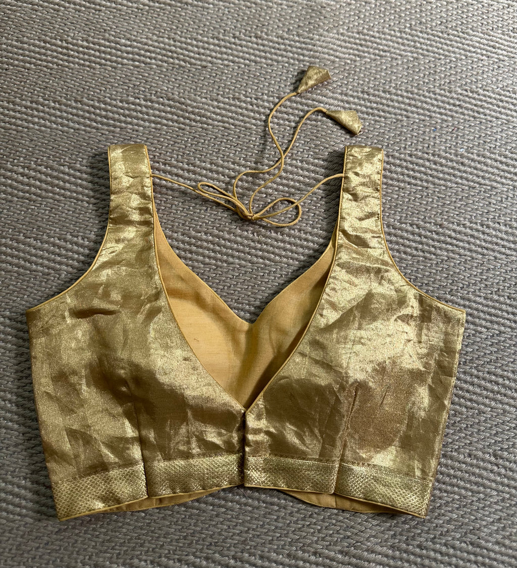 Gold tissue sleeveless blouse