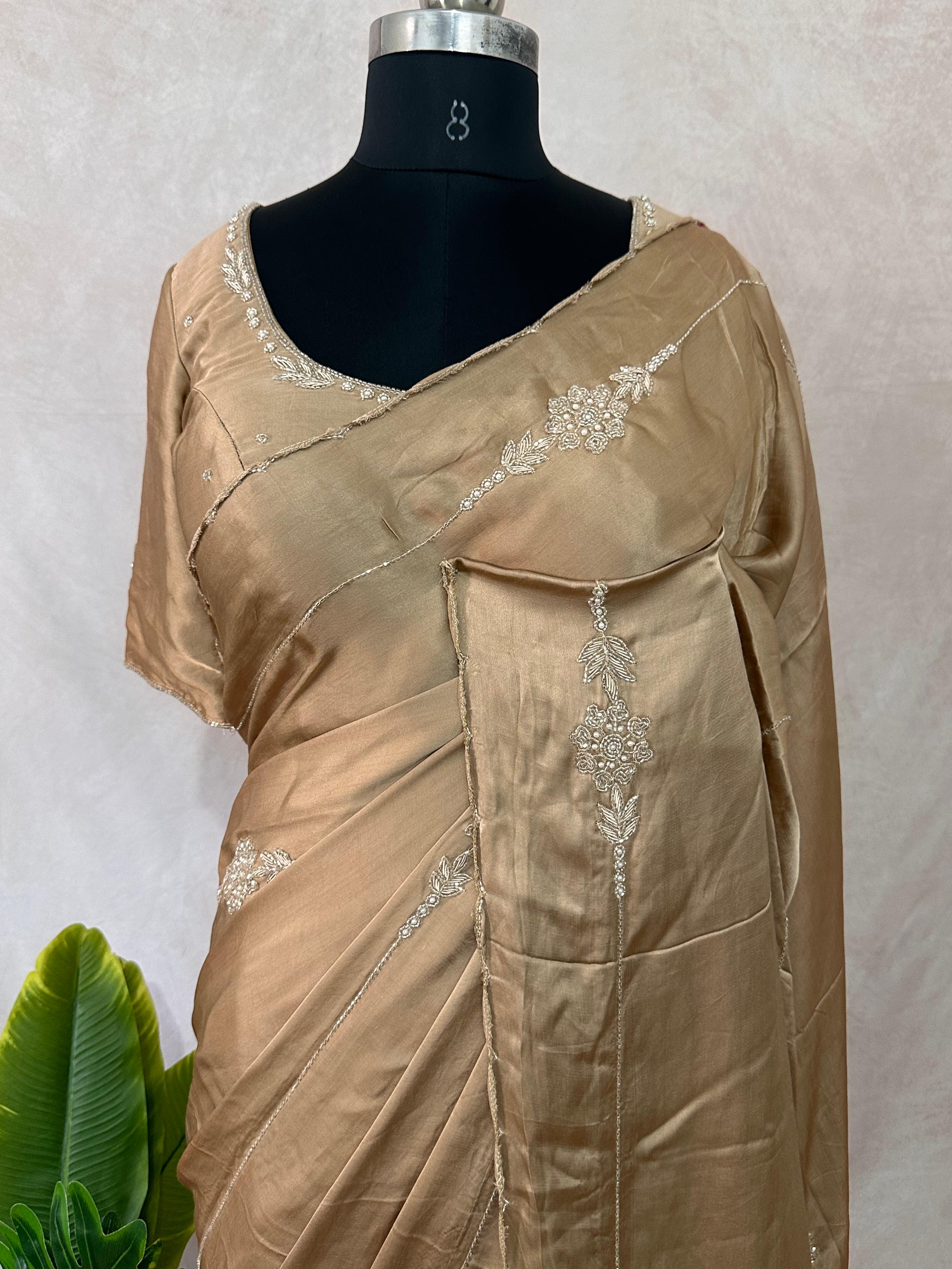 Modal silk saree with hand embroidery and stitched blouse
