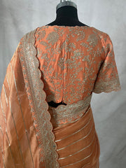 Orange Tissue oraganza saree with designer blouse