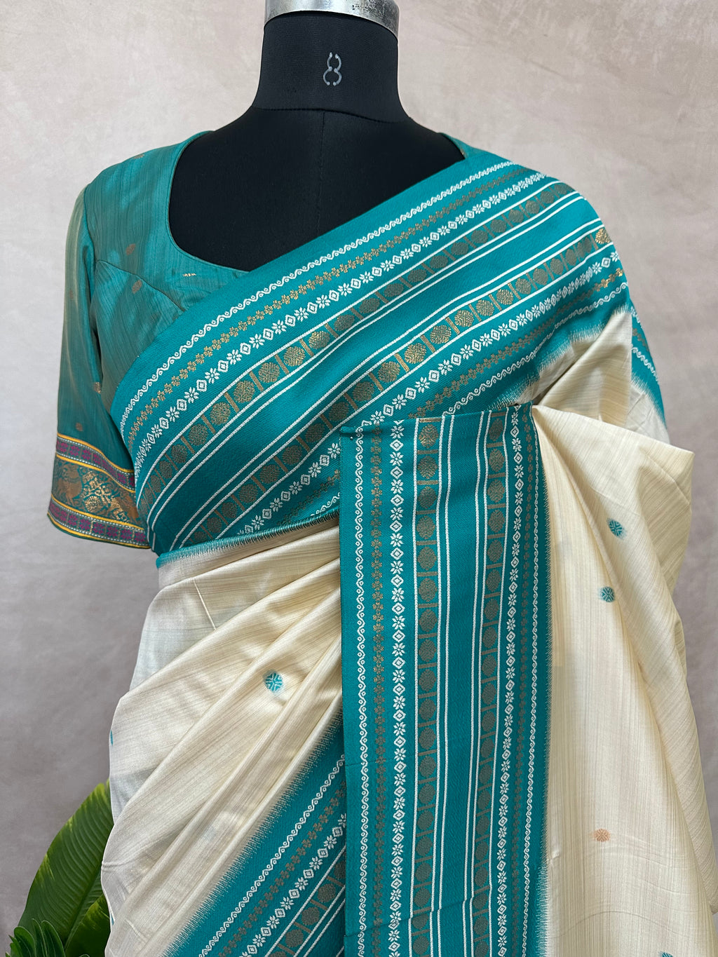 Asam silk saree with Turquoise green broder and stitched blouse