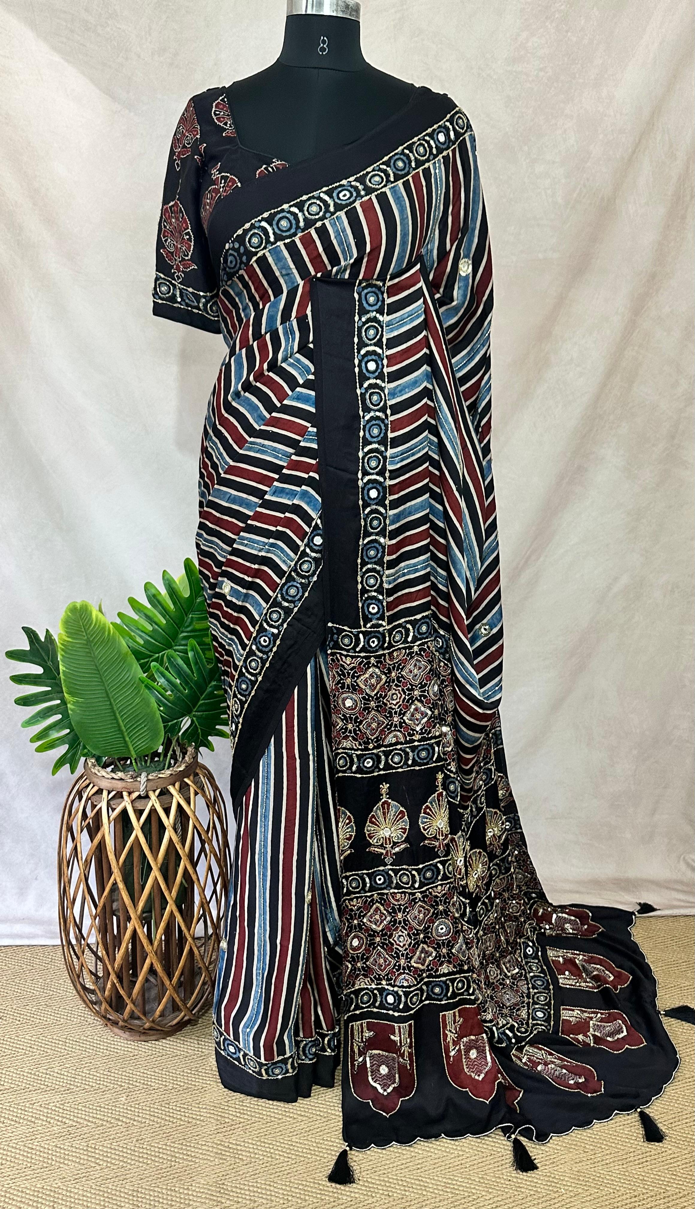 Designer Ajrakh modal silk saree with bead and mirroer handwork, stitched blouse