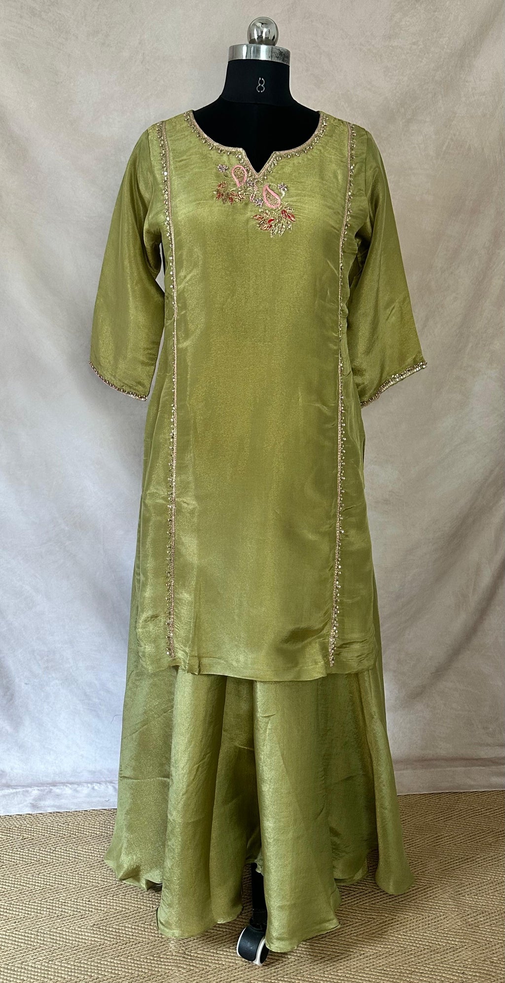 Olive green tissue silk short kuti with hand emroidery and flared palazzo and dupatta