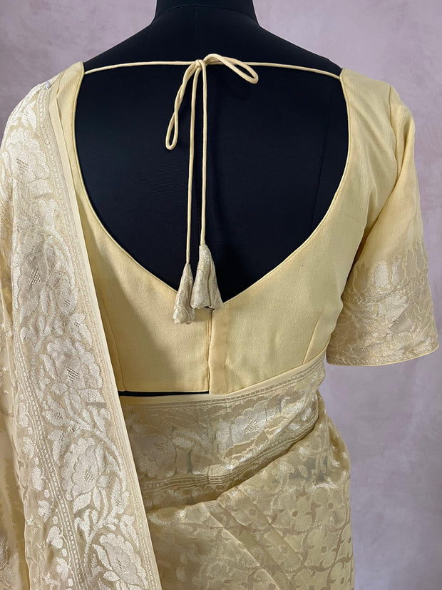 Light yellow pure Geogette silk saree with stitched blouse