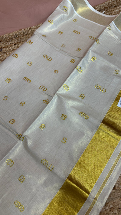 Malayalam alphabet embroidery saree