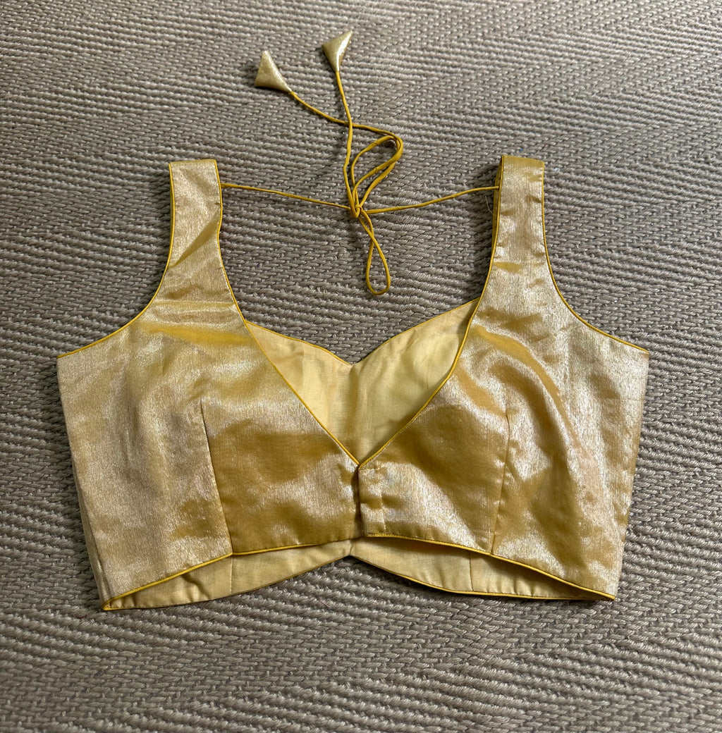 Gold tissue sleeveless blouse