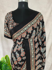 Black modal silk saree with hand work and stitched blouse