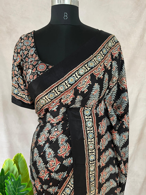 Black modal silk saree with hand work and stitched blouse