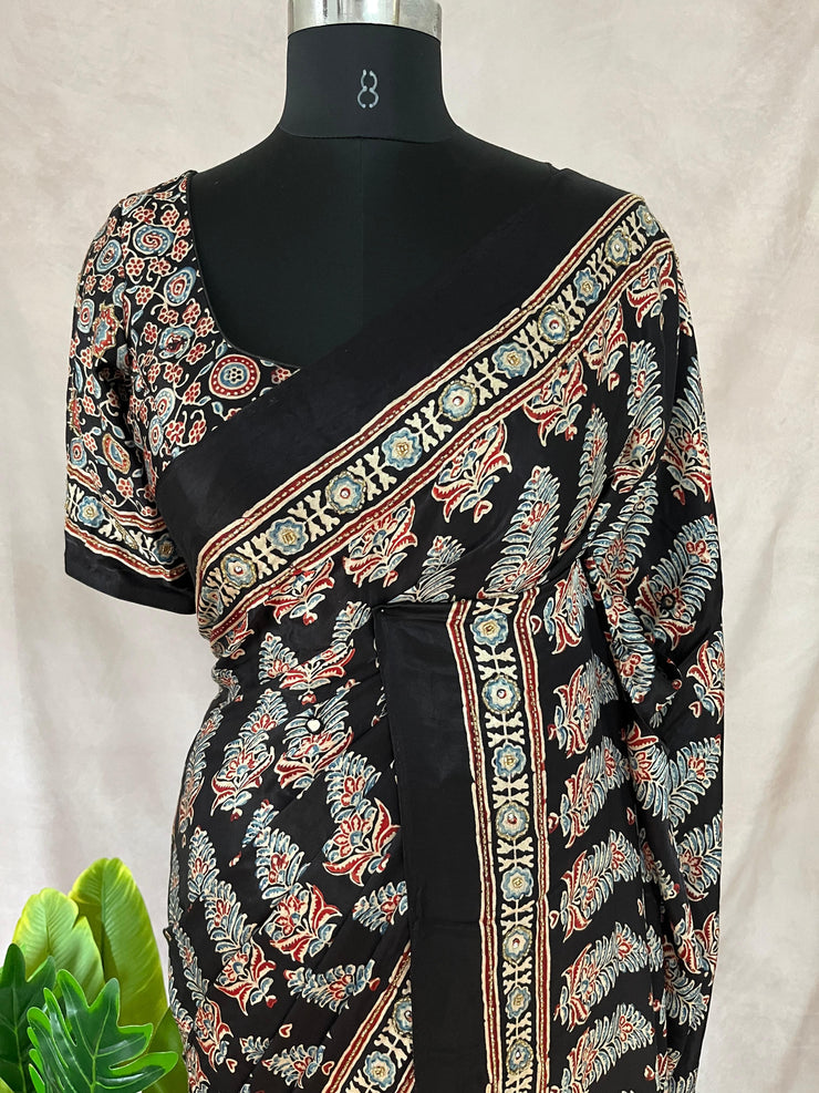 Black modal silk saree with hand work and stitched blouse